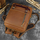 Brown leather shoulder backpack for travel with adjustable straps and multiple compartments