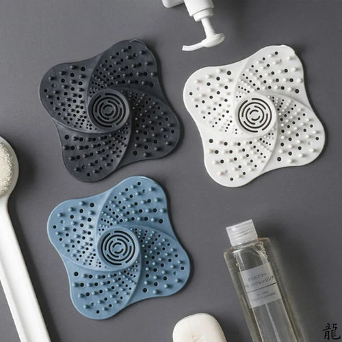 shower hair catcher drain cover in gray, blue, and white for bathrooms