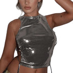 Shiny silver side tie metallic tank top worn by model with sleeveless high neck design