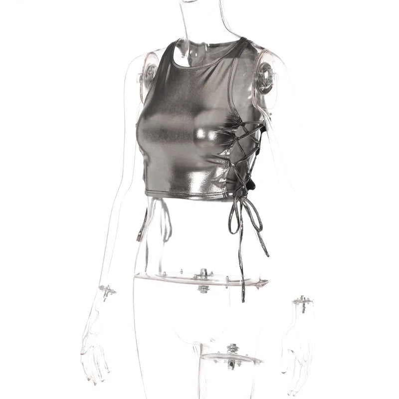 Side tie metallic tank top in shiny silver with lace-up detailing on a transparent mannequin