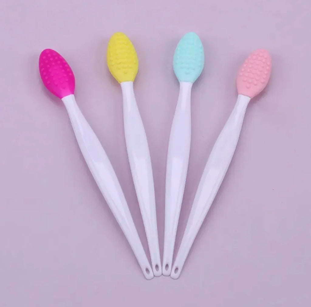 Silicone face brush for blackheads in pink, yellow, green, and blue