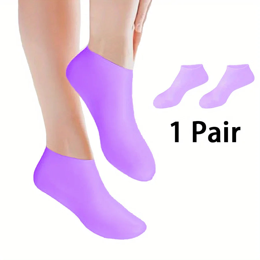 Silicone moisturizing sock worn on foot to treat dry, cracked heels