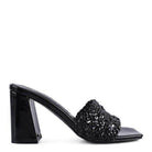Stylish black heels with a textured design, perfect for pairing with dresses or casual outfits