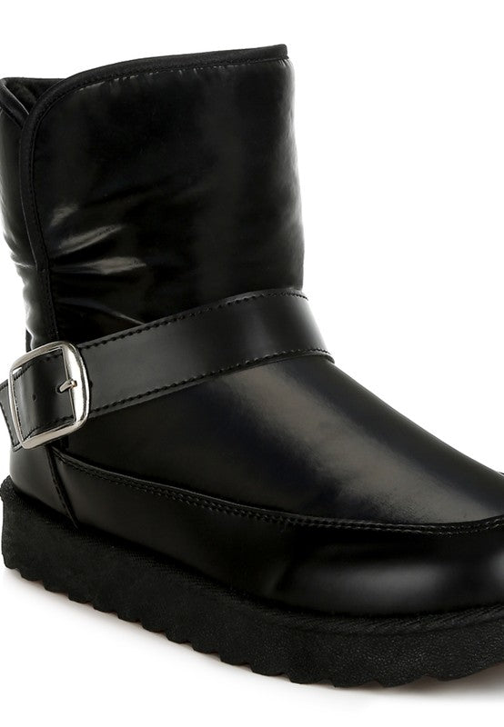 Black ankle boots with a silver buckle strap, perfect for stylish women's footwear