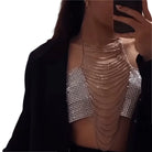 Rhinestone body chain top clubwear with layered chains and silver rhinestone bandeau under black jacket