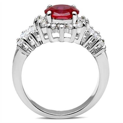 Elegant silver ring with red gemstone and sparkling accents for formal occasions