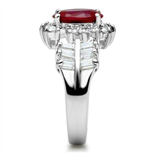 Elegant sterling silver ring with red gemstone and sparkling accents, perfect for any occasion