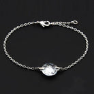Silver tone bead bracelet with a faceted central stone, perfect for casual or formal wear