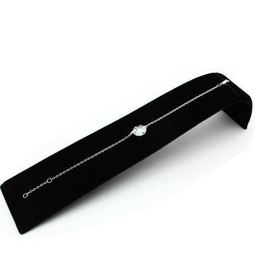 Silver tone bead bracelet with a delicate design displayed on a soft black velvet surface