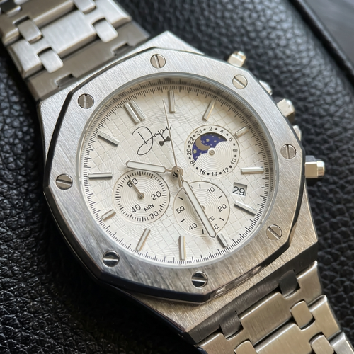 Dapper silver wrist watch with textured face and chronograph features