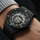 Dapr Watches Skeleton automatic watch for men with a black case and visible mechanics on wrist