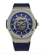 Dapper men's skeleton watch with blue dial and silicone strap