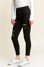 Women's black skinny pants jeans with distressed detailing for casual outfits
