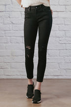 Women's black skinny pants jeans with distressed details for casual wear