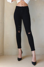 Women's black skinny pants jeans with distressed knee detailing