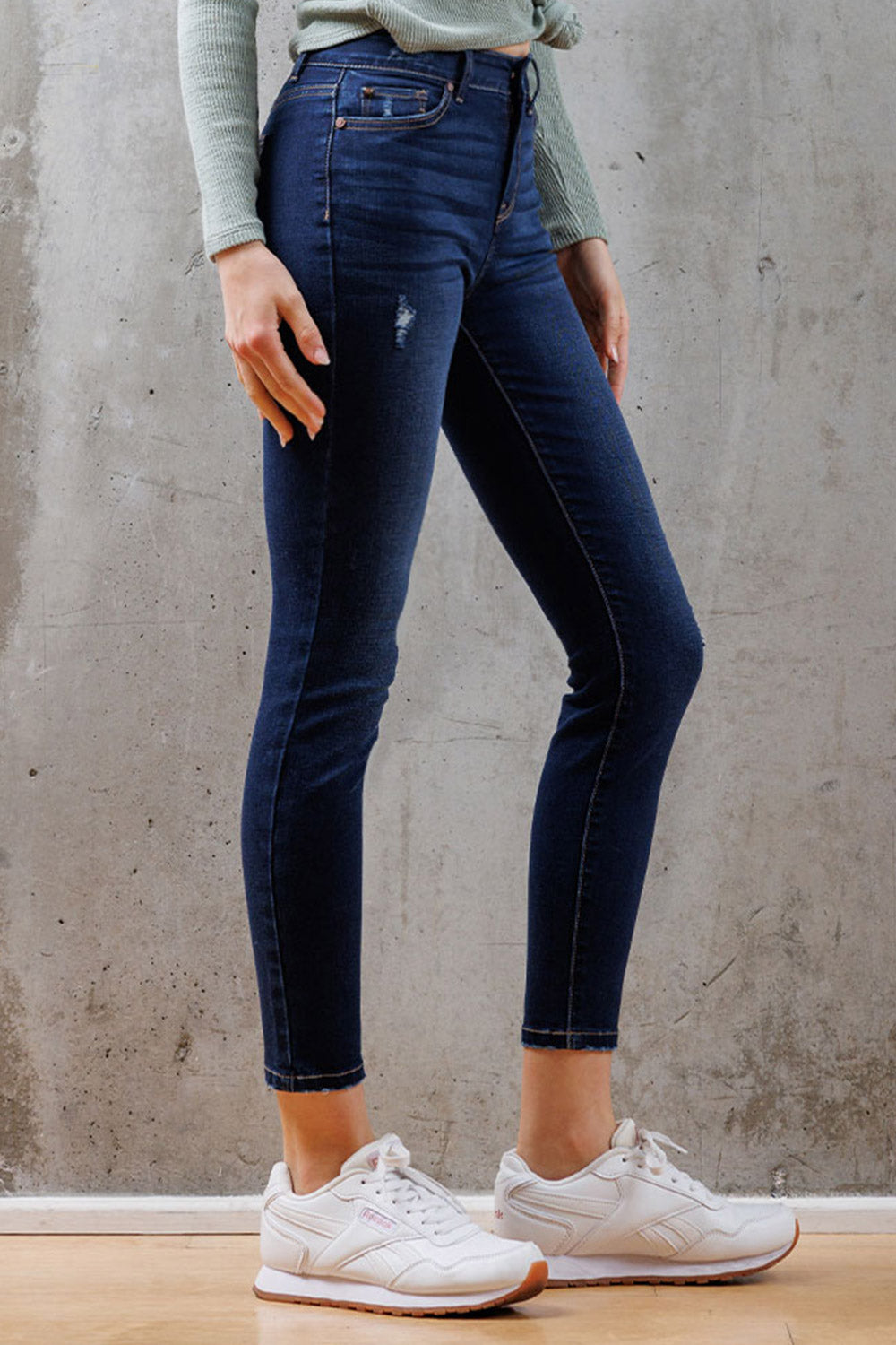 Women's dark blue skinny pants jeans with distressed detailing, perfect for casual wear
