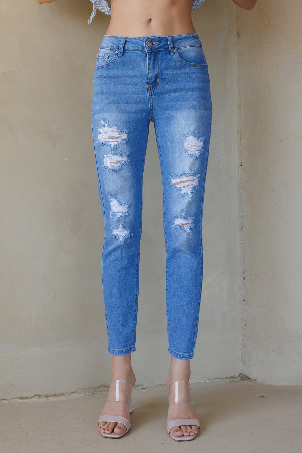 Women's blue skinny pants jeans with distressed detailing for casual wear