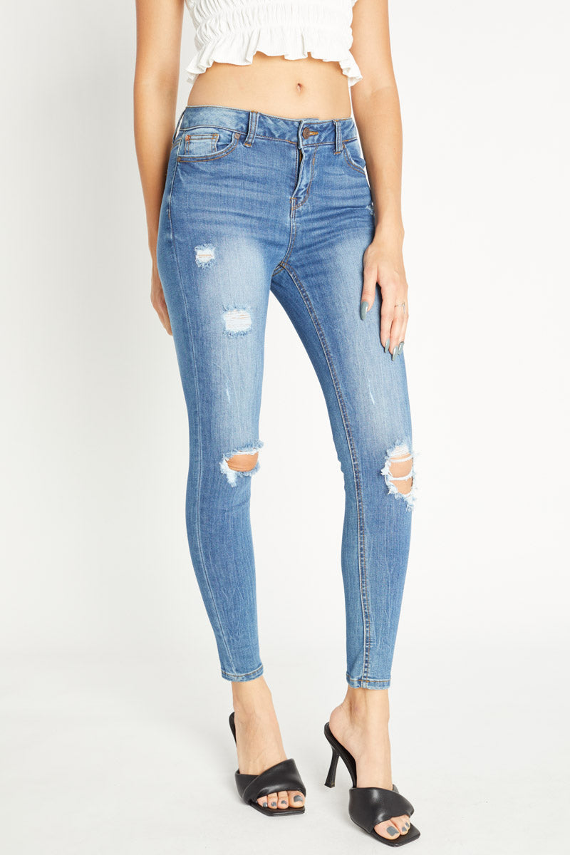 Women's light blue skinny pants jeans with distressed detailing