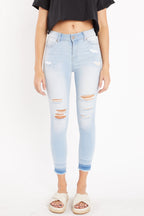 Women's light blue skinny pants jeans with distressed design for casual wear