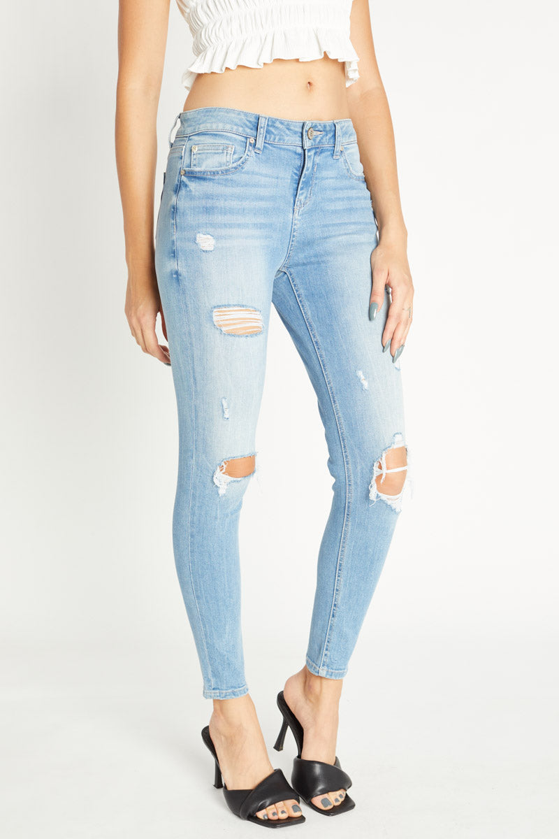 Women's light blue skinny pants jeans with distressed detailing for casual wear
