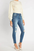 Women's light blue skinny pants jeans, stylish with distressed details
