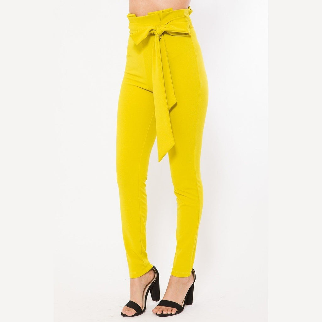 Yellow women's skinny pants with belt accent from VacationGrabs styled with black high heel sandals