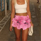 Women's pink floral mini skirt, perfect for beach vacations
