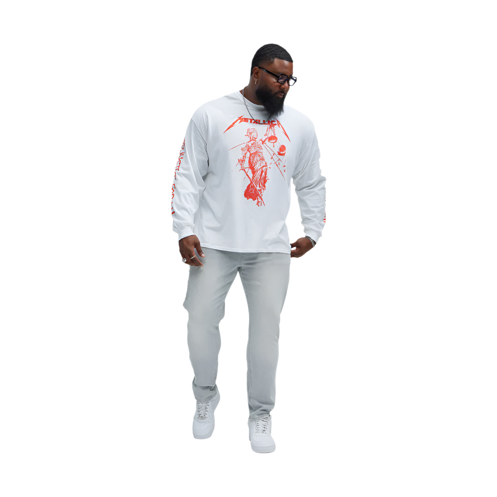 Man wearing slate grey jeans for men paired with white graphic long sleeve shirt and white sneakers