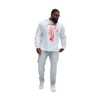Man wearing slate grey jeans for men paired with white graphic long sleeve shirt and white sneakers