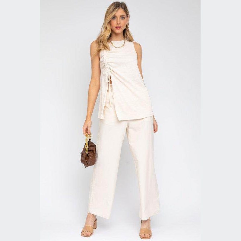 Gilli women's sleeveless ruching top in cream, styled with wide-leg pants for a chic look