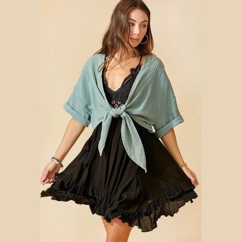 La Miel sleeveless summer dress with a black ruffled hem and a stylish light blue tie-top