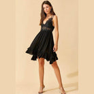 La Miel sleeveless summer dress in black with ruffled hem and lace details for a stylish look