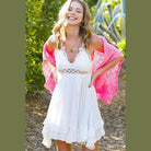 La Miel sleeveless summer dress in white with lace detailing and ruffled hem for a stylish look