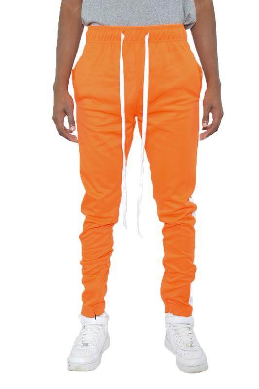 WEIV slim fit track pants for men in vibrant orange with drawstring waist and tapered legs
