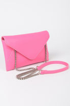 Small black evening clutch bag with a sleek design, perfect for formal occasions and stylish nightouts