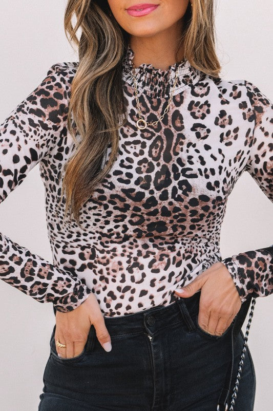 JUNIPER BLVD smocked neck long sleeve bodysuit featuring a trendy leopard print design