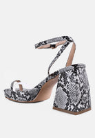 London Rag International snake print block heel sandals with a stylish ankle strap for a chic look