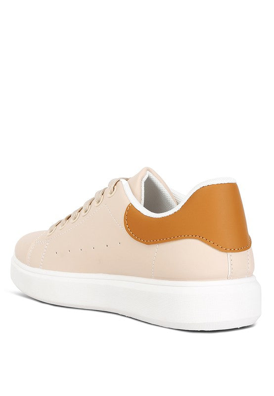 Women's nude sneakers with tan accent, perfect for casual outings