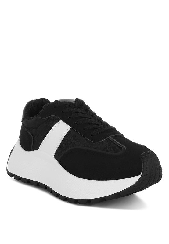 Women's black sneakers by Rag Company with white accents for casual wear
