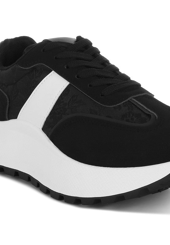 Women's black and white sneakers with cushioned sole for casual wear
