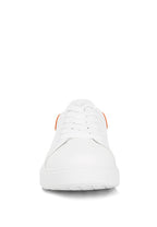 Women's white sneakers by Rag Company with orange accents for casual wear