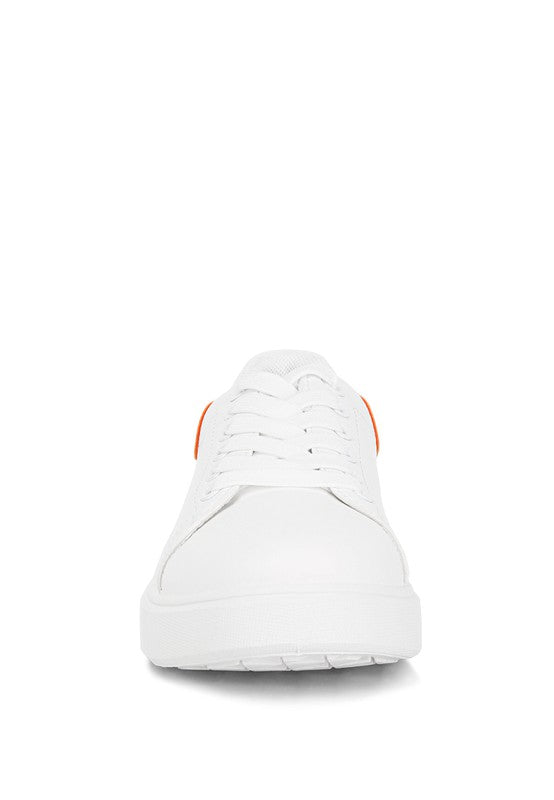 Women's white sneakers by Rag Company with orange accents for casual wear