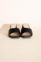 Fortune Dynamic Nina block heel mules in black with quilted design and open-toe style