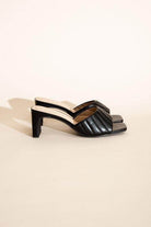 Fortune Dynamic Nina block heel mules in black with quilted design and open toes for stylish comfort