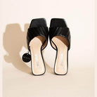 Fortune Dynamic Nina block heel mules in black with stylish quilted design and open toe