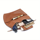 Brown soft hobo bag with drawstring handle and interior pockets for easy organization