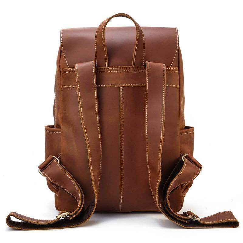 Brown soft leather backpacks for travel with adjustable straps and multiple pockets