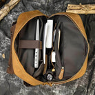 Interior view of soft leather backpacks for travel showcasing spacious compartments and organizational pockets