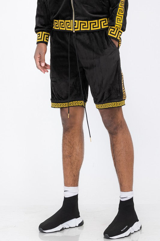 WEIV black soft velour athletic shorts with gold geometric trim worn by male model