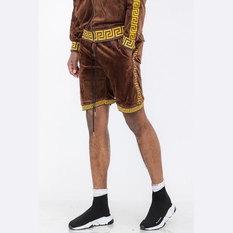 WEIV soft velour athletic shorts in brown with yellow geometric trim on a male model